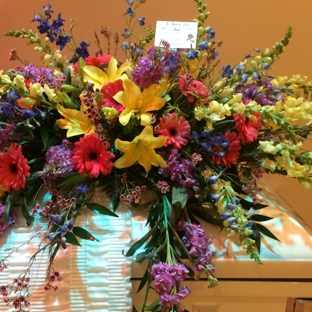 A Touch Of Class Florist - Vestavia, AL. Spring mix casket cover of common and holland mix flowers