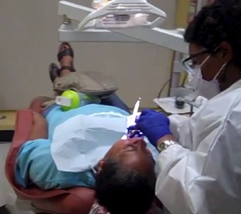 Premier Dental Care - Washington, DC. Dental hygienist at work at Premier Dental Care Washington DC