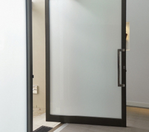Bradnam's Windows & Doors - Boondall, QLD. Black Aluminium Pivot Door With Obscure Glass