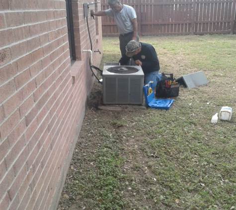 C& B ELECTRIC & A/C SERVICES - Mcallen, TX. my two workers worhinh on ac condenser unit 