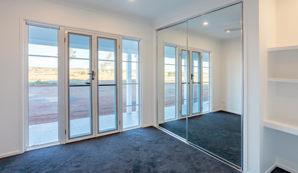 Bradnam's Windows & Doors - Emerald, QLD. Mirror Sliding Wardrobe Door