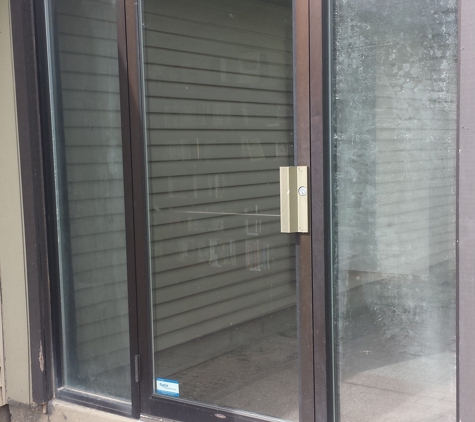 Malibu Glass & Shower Door - Grand Rapids, MI. Foggy, unsightly sidelites in this commercial building.