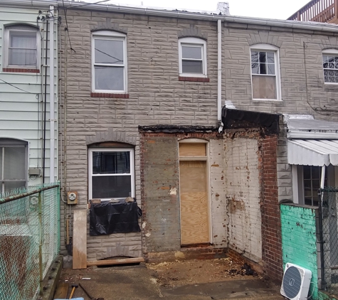 Herb's Formstone and Stucco Company - Glen Burnie, MD. Before - old brick demo on rowhome in Baltimore