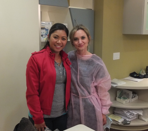 Sweet Tooth Care Inc - Milpitas, CA. Olga, our hygienist with patient.