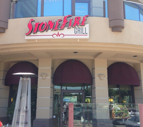 Stonefire Grill - Santa Clarita, CA. Outdoor seating area with sign