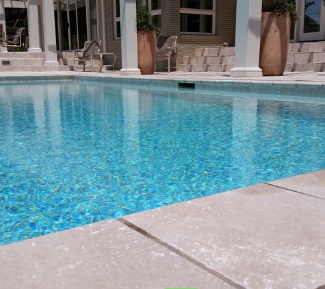 Atlantis Pools & Spas - Gaston, SC. Negative edge pool/Travertine Deck