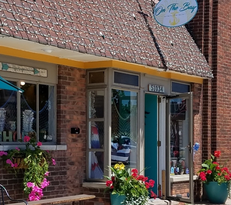 On the Bay Customs Boutique & Cafe - New Baltimore, MI. Unique gifts, home decor, pottery, signs