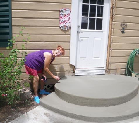 Kelly's Home Improvement - Angleton, TX. One happy customer! Finishing touch; signature in wet concrete!