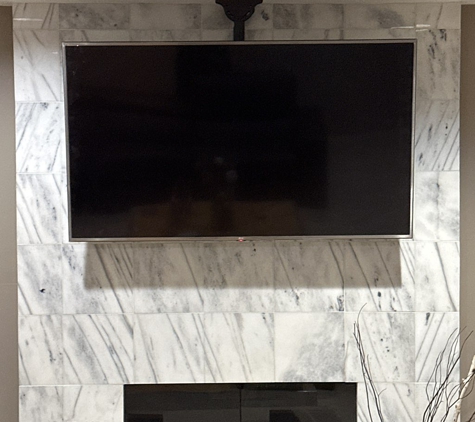 Rtechwork - Grosse Pointe Woods, MI. Tv mounting from ceiling above fireplace