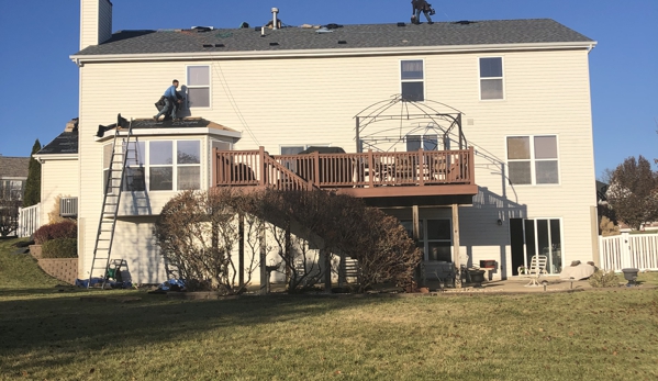 Barr Roofing & Exteriors. View from the back of work being completed 