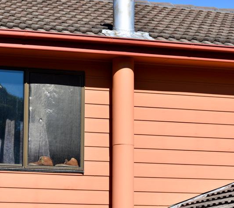 Total Roof Restoration - East Corrimal, NSW. Old Chimney through lower and upper tiles