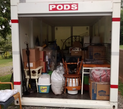 Asheville Moving Helpers - Candler, NC. Asheville Moving Helpers (828) 338-9191 - Preparing to unload a POD