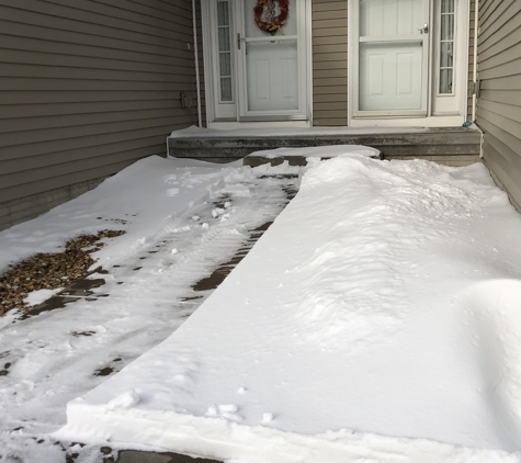 Greg's Lawn Service. Sidewalks partially done. They came back 2 days later to finish clearing them.