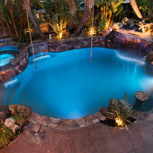 California Aqua Pros - brentwood, CA. Pool with grotto, waterfall, beach approach, Laminars, Sheer Descent, fiber optic lighting.  Koi Pond and  fire pit