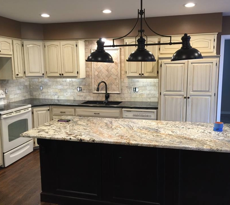 Christopher Painting, LLC - Mission Hills, KS. Kitchen cabinets went from oak to antique white with a glaze