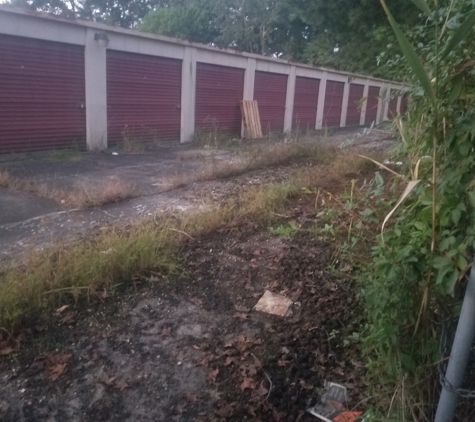 Chesapeake Self Storage - Grasonville, MD. Nice driveway to drive through. See resident agents name and number on no trespassing sign on the gate.