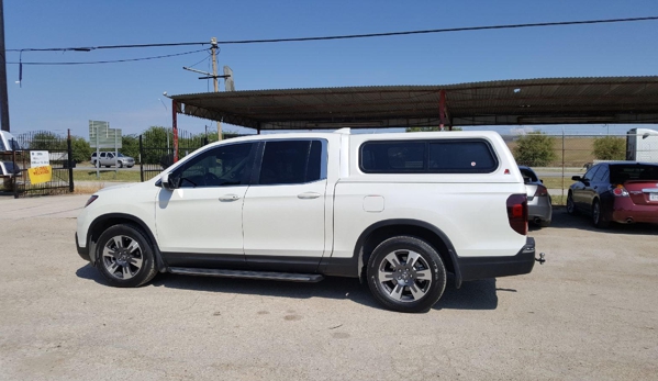 Alamo City's Uresti Camper Sales & Truck Specialties - Von Ormy, TX. 2017 Honda RidgeLine w/Leer 100XR