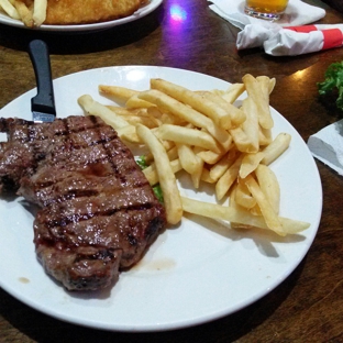 Johnny Malloy's - Bonita Springs, FL. My steak and fries.....cooked to perfection.