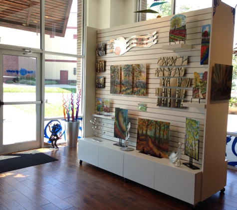 Blue Pomegranate Gallery - Omaha, NE. Blue Pomegranate Gallery in Village Pointe Shopping Center carries American hand made fine art, fine crafts, jewelry and gifts!