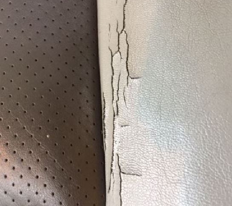 Top Line Auto Upholstery - Crystal Lake, IL. Here you can see the longitudinal cracks in the Driver Seat vinyl bolster that ran along side the Perforated Leather Seat Surface..