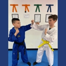 High Kick T K D - Martial Arts Instruction