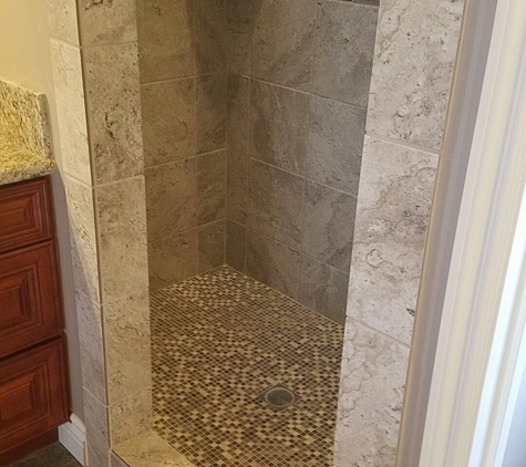 Hard Surfaces AZ - Bullhead City, AZ. tile shower with tile plank flooring just before the frameless shower doors are installed