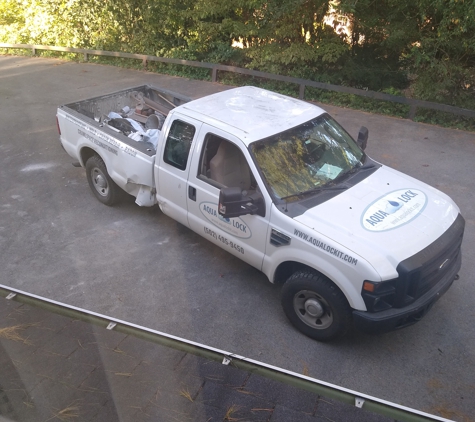 Aqua Lock - Louisville, KY. Vehicle blocking garage doors (part of retaliation/intimidation/strong arming)