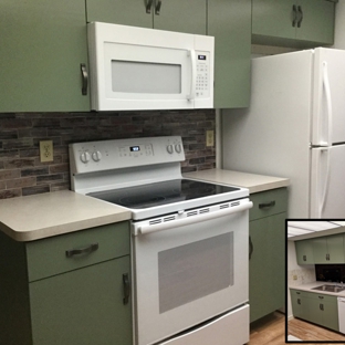 Accent Woodworking Inc. - Largo, FL. Custom Real Wood Kitchen Cabinets with Modern Flat Doors and Drawers are shown in custom green Nesika Bay and upgraded premium pulls