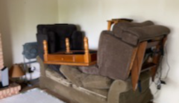 ServiceMaster Restoration Services - Lisle. 2 recliners and a coffee table piled on my sofa