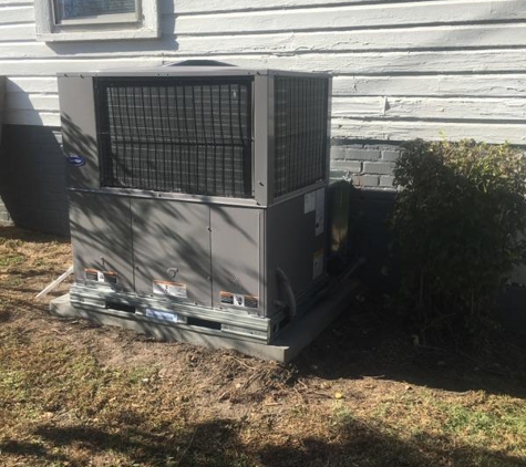 Prime Comfort - Charlotte, NC. Carrier package heat pump with custom weather cover flashing