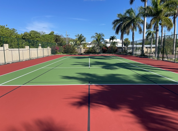 First Class Courts, Inc - Parkland, FL. Tennis court resurfacing with blended pickleball lines at the Oceanview Condo in Freeport, Bahamas.