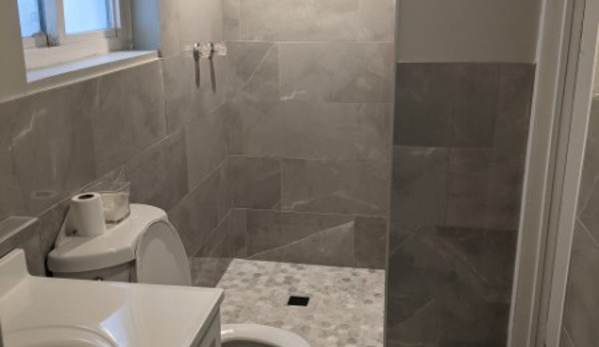 Admire Construction Inc - Jamaica, NY. Admire Construction completely remodeled this bathroom by extending it a couple of feet, retiling the whole perimeter, and adding plumbing.