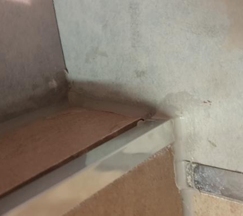 Only Floors - Edge Hill, QLD. No grout and poor silicone application