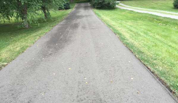 T Burkes Asphalt & Concrete Paving - Ann Arbor, MI. Out front, down toward the road