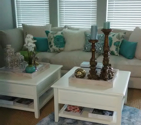 LRK Decor - The Colony, TX. Double duty. We used two coffee tables here instead of just one. It's the perfect solution when you have an oversized sofa. We wanted the space to be calming and serene, so we chose cool blues and greens for our accent colors. How beautiful is that!