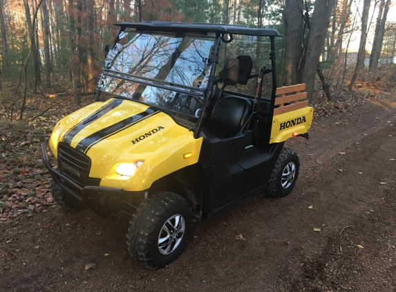 Hubbard Automotive - Coral, MI. Our yellow Honda 
Big red muv