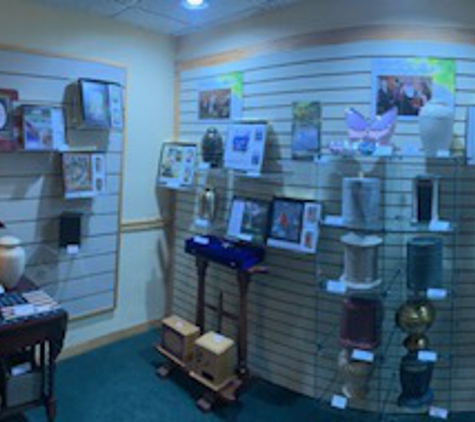 MacDonald Funeral Home & Cremation Services - Tampa, FL. Our Urns and Memorial book packages on display