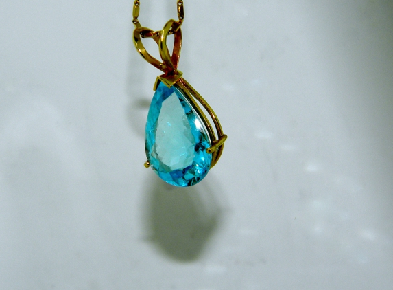 Adam's Jewelry 611 - Stroudsburg, PA. Blue Topaz on Yellow Gold Pendant