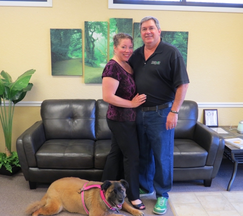 Thrive! Chiropractic & Wellness - Saint Petersburg, FL. Dr. Kelley, her husband Michael Mulhern and Suki