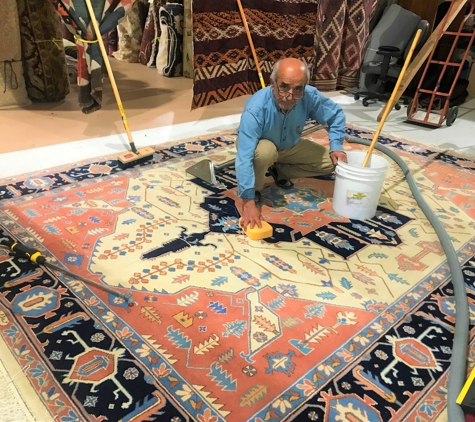 Bay Area Rugs Outlet - San Mateo, CA. Ali cleaning a Persian Heriz Rug.