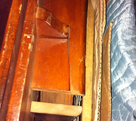 Furniture Medic. An antique wooden drop leaf table cracked.