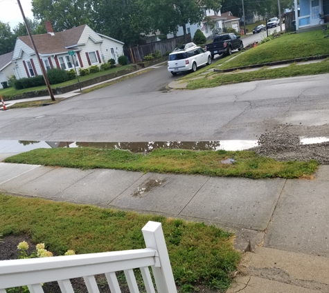 L J De Weese Co Inc - Tipp City, OH. Flooding from the gravel blocking water from going down the street into a drain.
