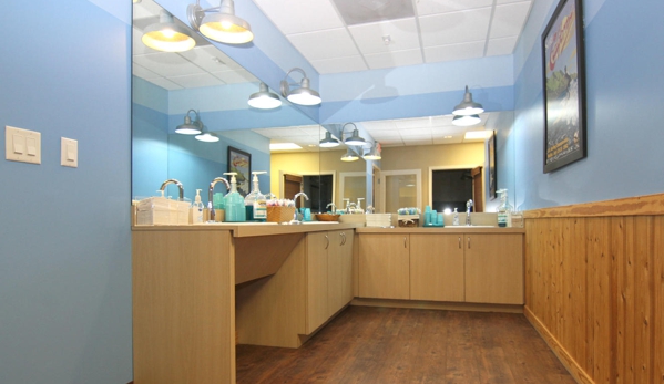 Smiles Of Austin - Austin, TX. Brush and floss station at Austin orthodontists and pediatric dentists Smiles of Austin