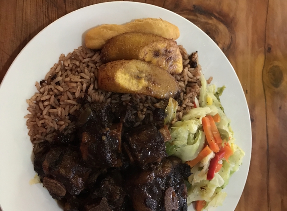 Little Kingston Jamaican Restaurant - Los Angeles, CA. Oxtails w cabbage, plantains, rice and bread