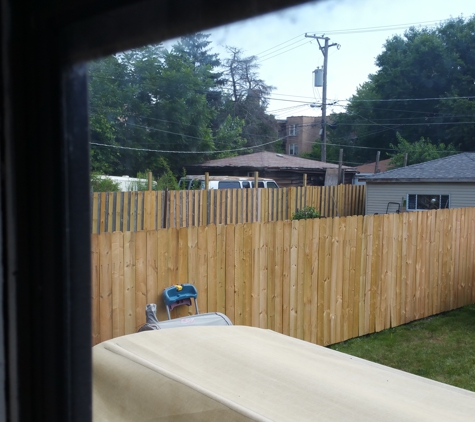 Figueroa 2nd Generation Construction Inc. - Chicago, IL. My fence is the new one. My neighbor was so impressed he copied.