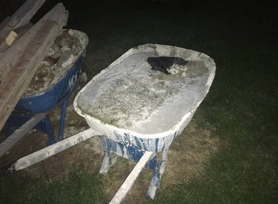 Bluewater Concrete & Carpentry - Saint Marys, KS. Wheelbarrow full of dry concrete still in yard