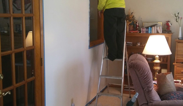 R.H.S. Construction Co. - Akron, OH. We bend over backwards to make our customers happy. In this case we painted an elderly customers living room after a roof leak.