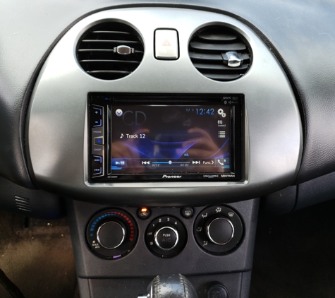 Manny's Auto Sound - Wellington, FL. New double din radio with backup camera and new dash to look as the original factory 