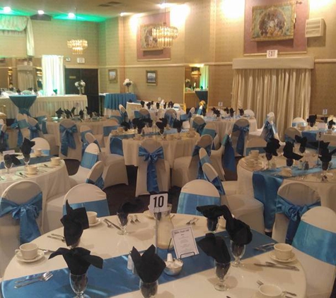 Edgemont Caterers - Philadelphia, PA. The tables in our banquet room beautifully set in blue!