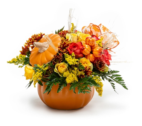 Between Flowers Design - Weston, FL. Celebrate the beauty of the fall season with our pumpkin vase fall flower arrangement delivery.